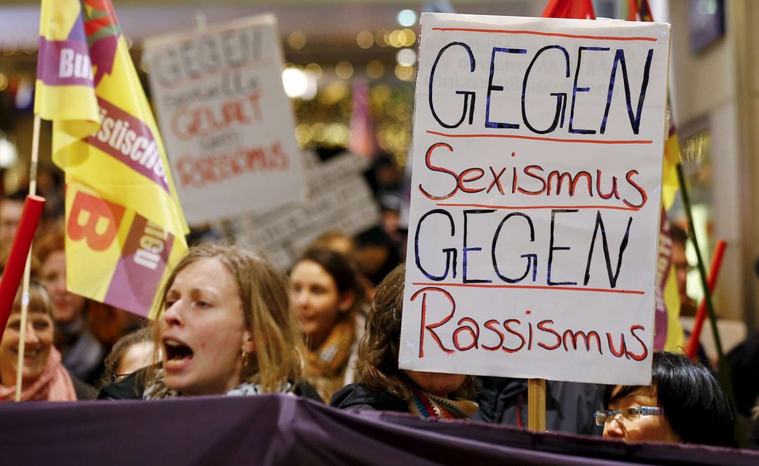 Protesters in Cologne, Germany with a placard that reads "Against Sexism - Against Racism" on Jan 5, 2016.