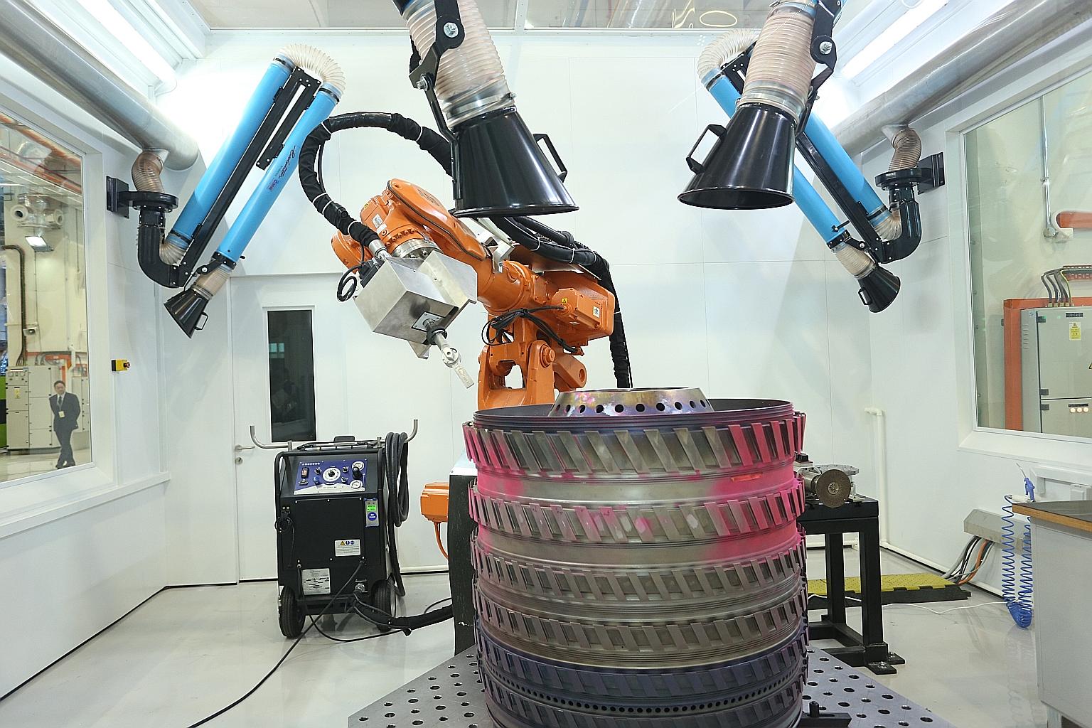 At the Advanced Remanufacturing and Technology Centre, aircraft parts are cleaned using dry ice-blasting.