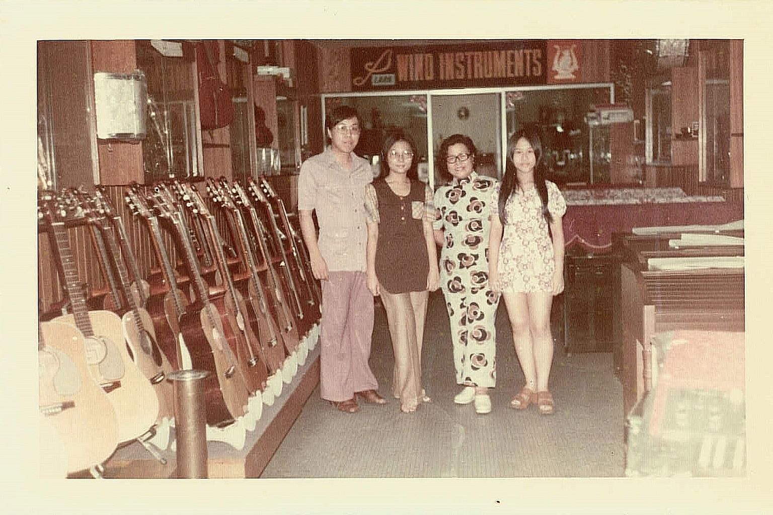 (From left) City Music founder Willy Hoe, his wife, Shirley, Mr Hoe's mother and an unidentified woman at their original store at Bras Basah.