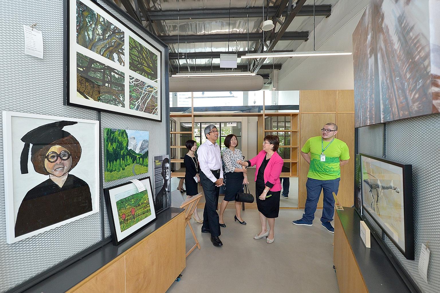 (From left) NLB CEO Elaine Ng; Dr Yaacob; SG Enable CEO Ku Geok Boon; Ms Phua; and ARC's Mr Victor Ong visiting the Digital Services Centre yesterday.