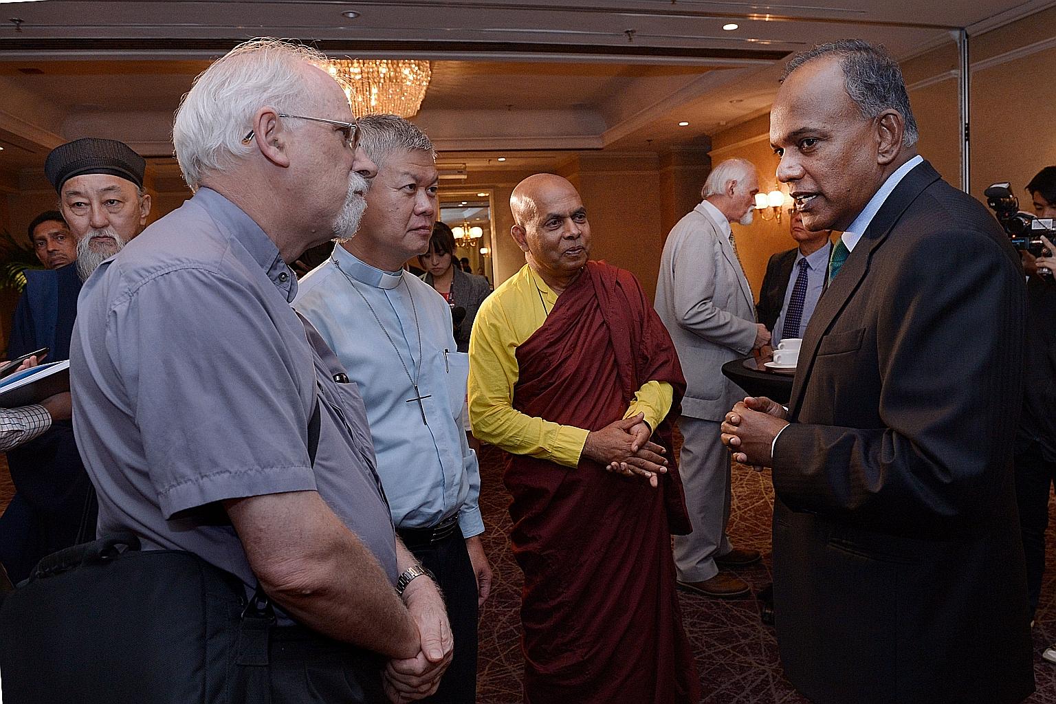 Home Affairs Minister K. Shanmugam (far right) chatting with (from second left) Reverend George Martzen, United Methodist Church missionary at Paya Lebar Chinese Methodist Church; Reverend Gabriel Liew, pastor of Kampong Kapor Methodist Church; and V