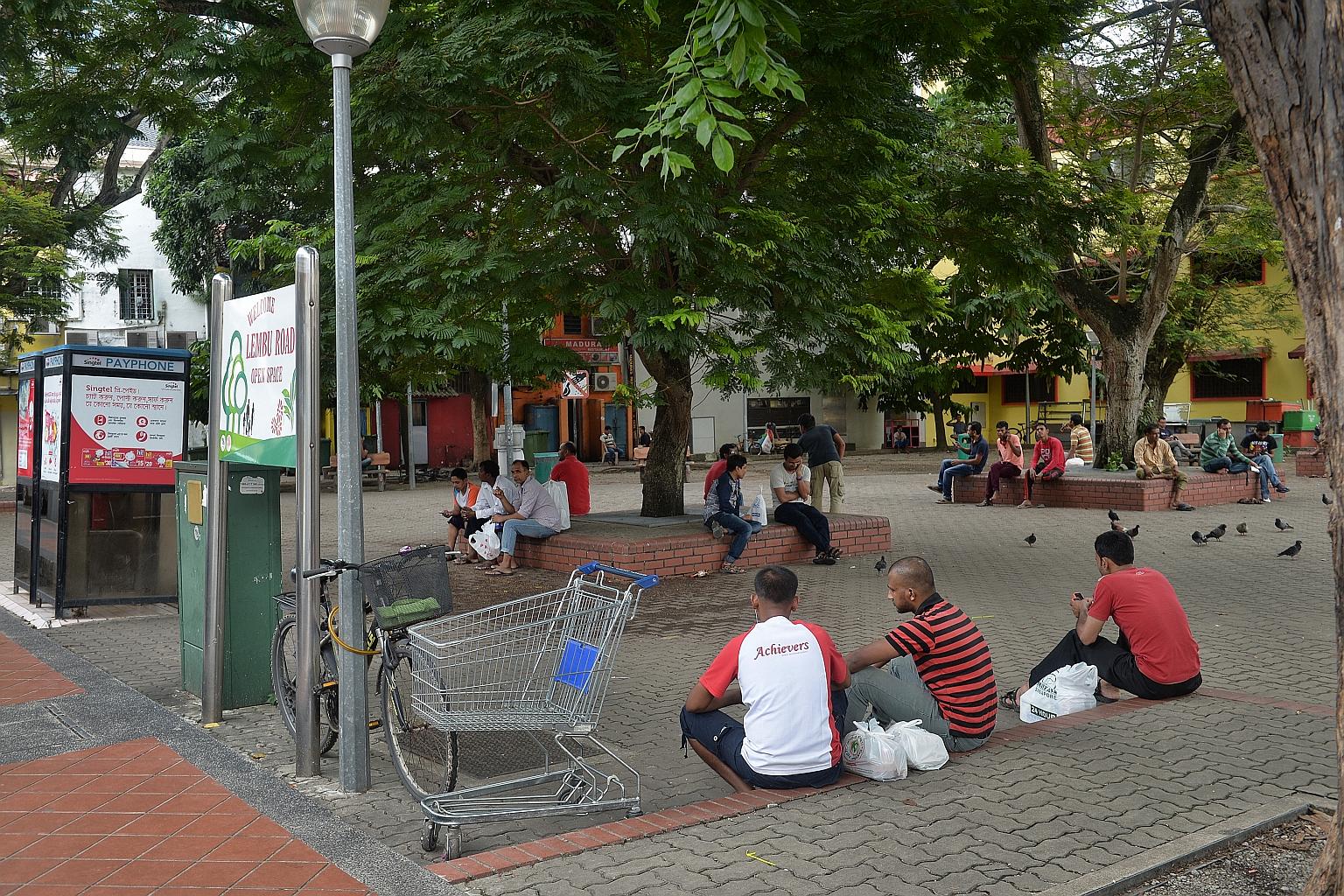 Some Bangladeshi workers spending their day off yesterday at the Lembu Road open space. Many worry about losing their construction jobs as the radicalised men were in the sector.