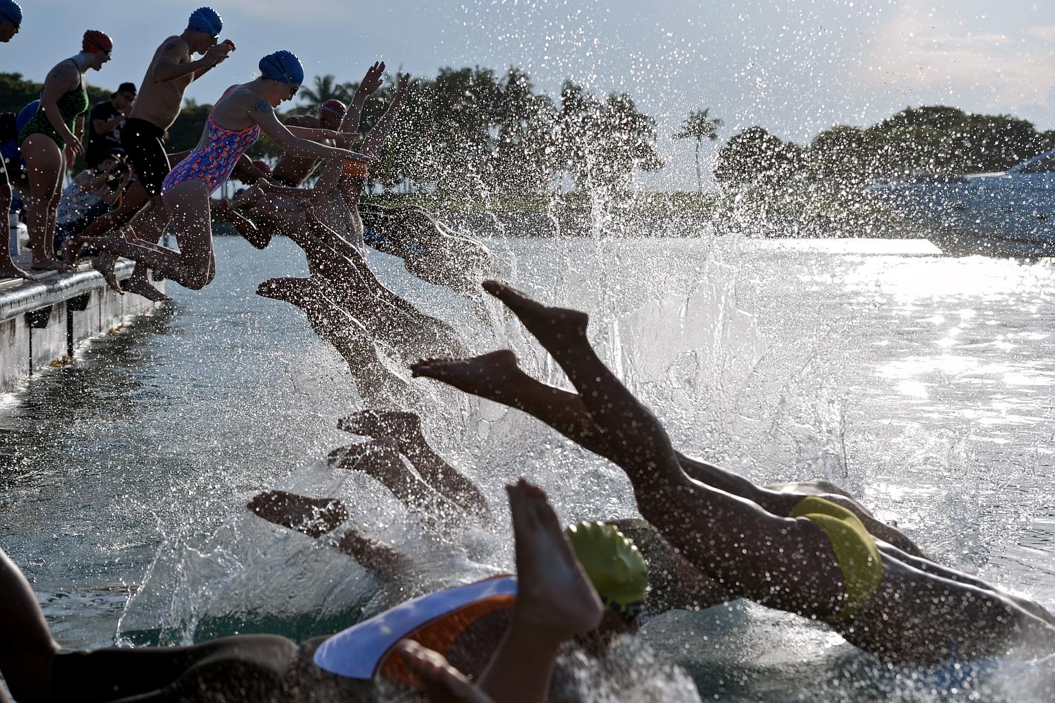 Sailors along Singapore's shipping channels may have wondered yesterday if there were dolphins in the area. Eighteen swimmers aged between 15 and 60 had a splashing good time as they swam 4km from Lazarus Island - an offshore island south of Singapor