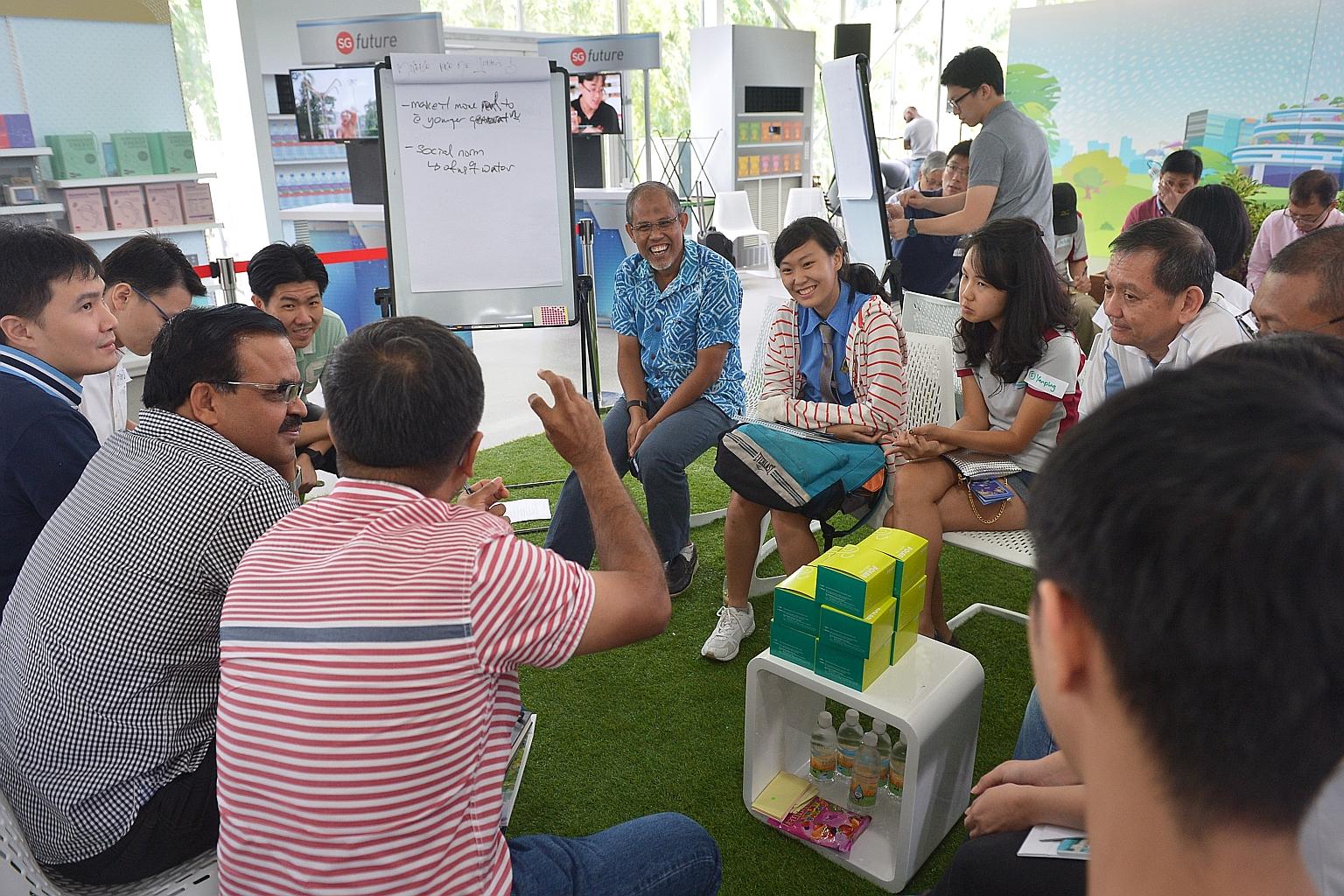 Minister for the Environment and Water Resources Masagos Zulkifli (centre, in blue) attending a focus group session on water at The Future Of Us exhibition at Gardens by the Bay yesterday. Participants gave suggestions on how Singaporeans can be enco