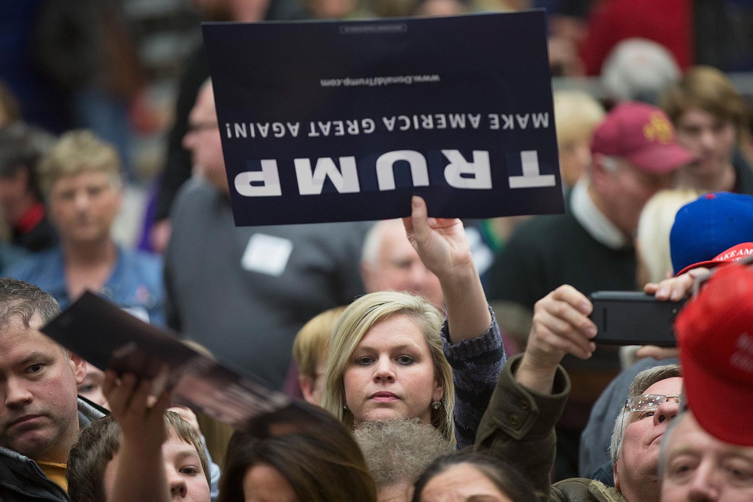 Supporters trying to meet Republican presidential candidate Donald Trump at a rally in Marshalltown, Iowa. 
