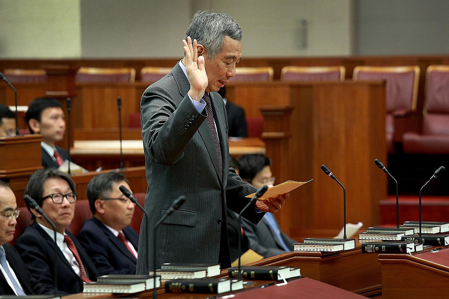 Prime Minister Lee Hsien Loong taking the oath of allegiance during the swearing-in ceremony at the opening of the 13th Parliament on Jan 15.