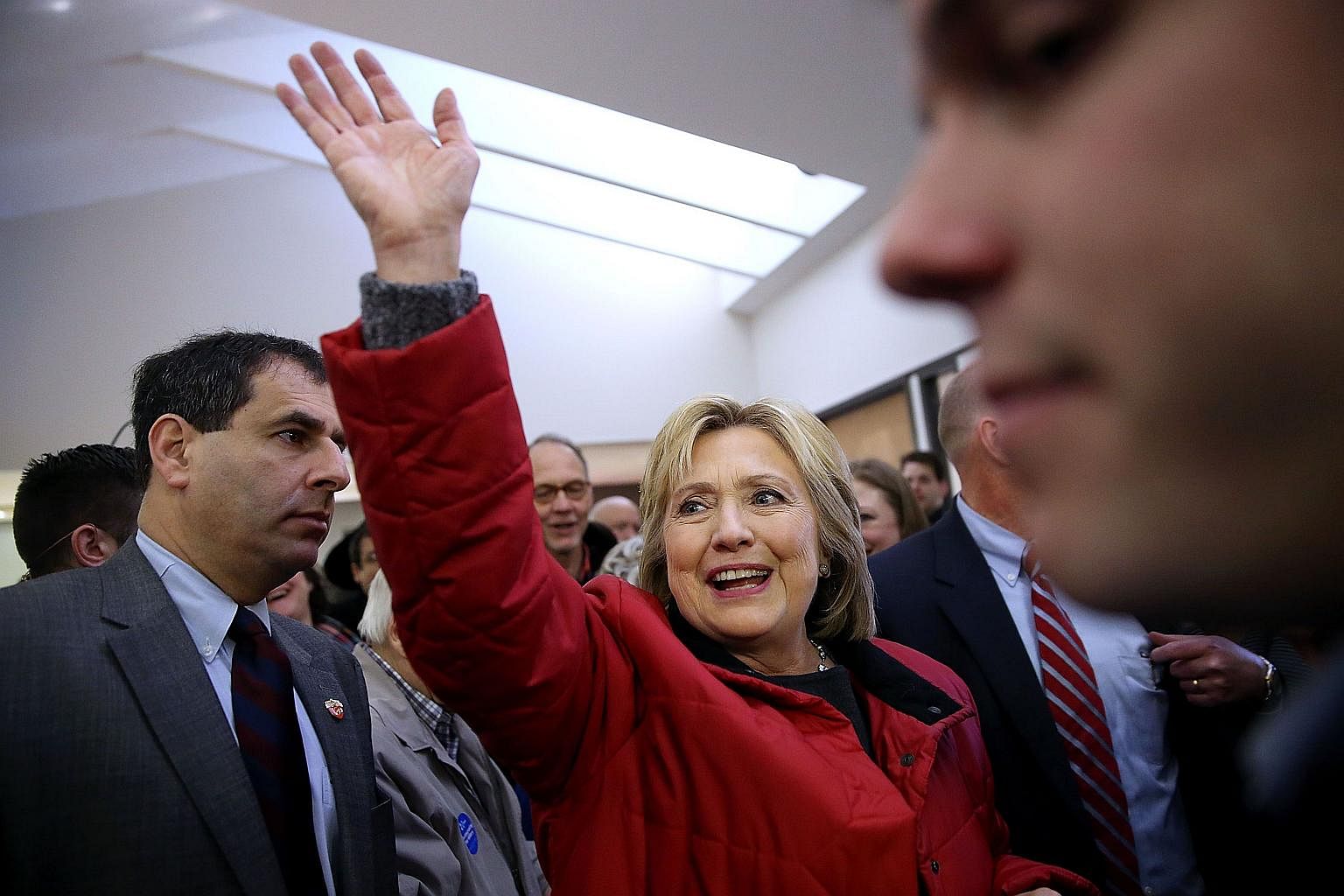 Democratic presidential candidate Hillary Clinton waves to supporters in Des Moines, Iowa.