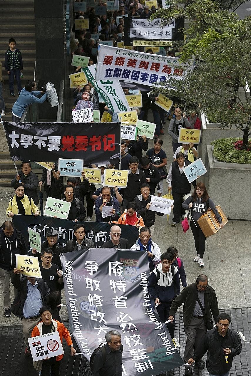 Protesters marching against the appointment of a pro-Beijing professor as the chairman of the governing council of the University of Hong Kong. The protest took place on Jan 3 this year.