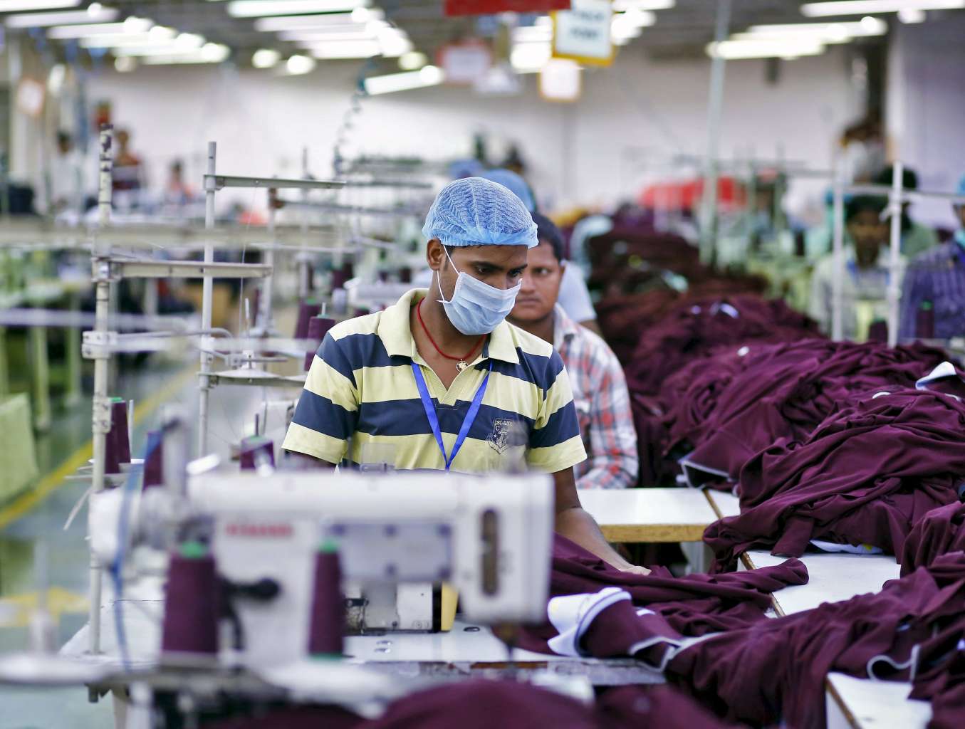 An employee working at a garment factory on the outskirts of New Delhi, India. 