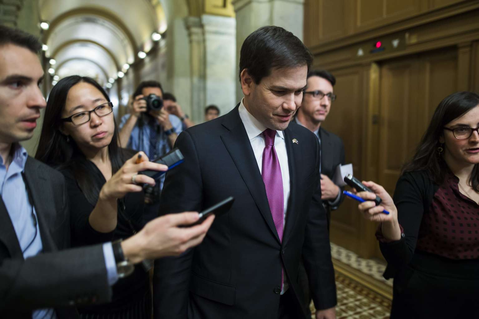 Mr Marco Rubio leaves the Senate Chamber after voting to impose stiffer economic sanctions on North Korea in the wake of its rocket launch.