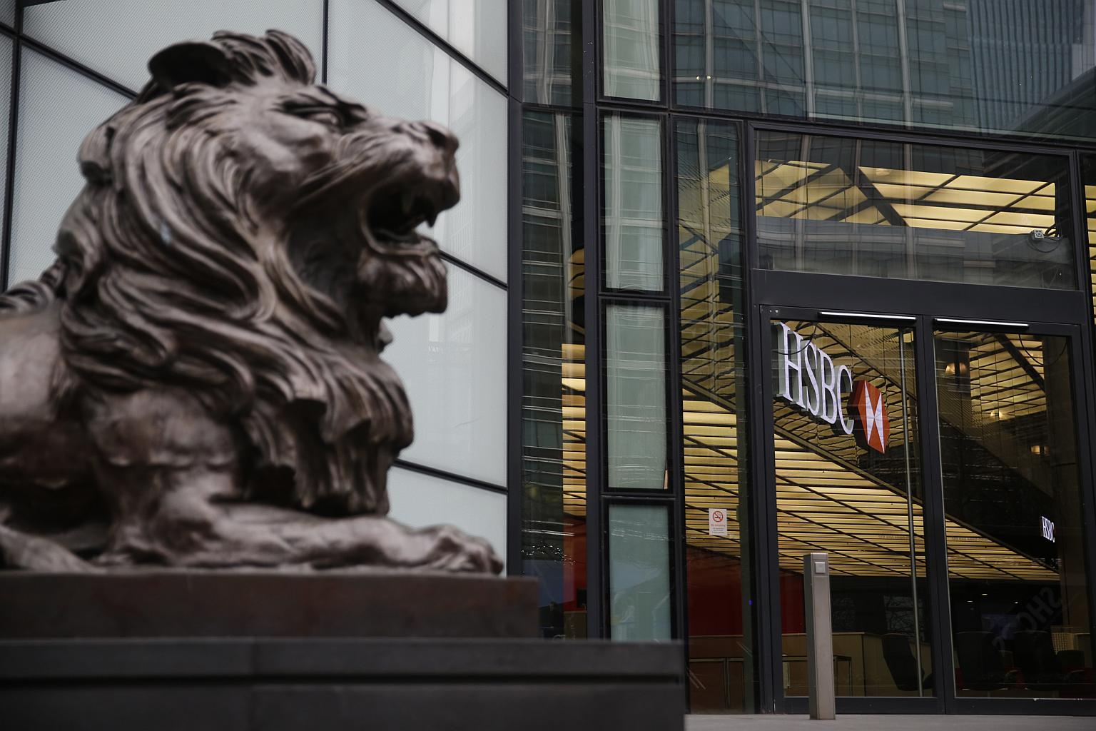 A sculpture of a lion sits outside the main entrance to the HSBC Holdings Plc headquarters in London.