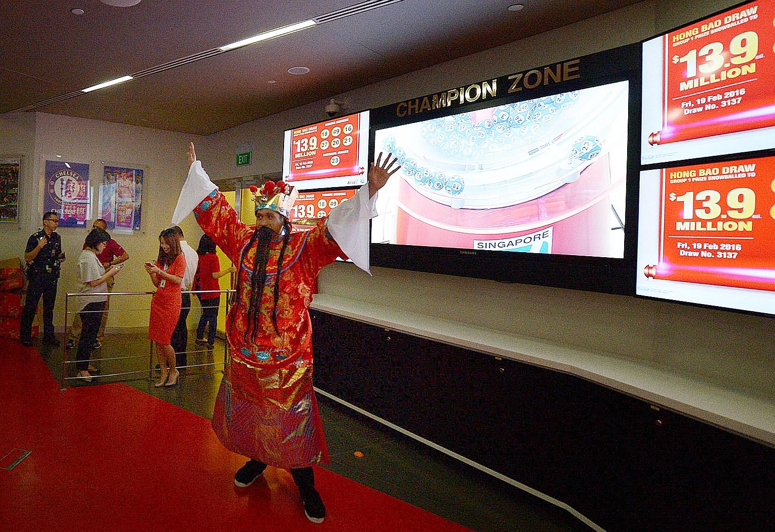 The God of Fortune was present at the draw at the Singapore Pools' main branch in Middle Road. Fortune smiled on two punters who picked the winning numbers 18, 49, 16, 27, 20, 21 and the additional number 23.