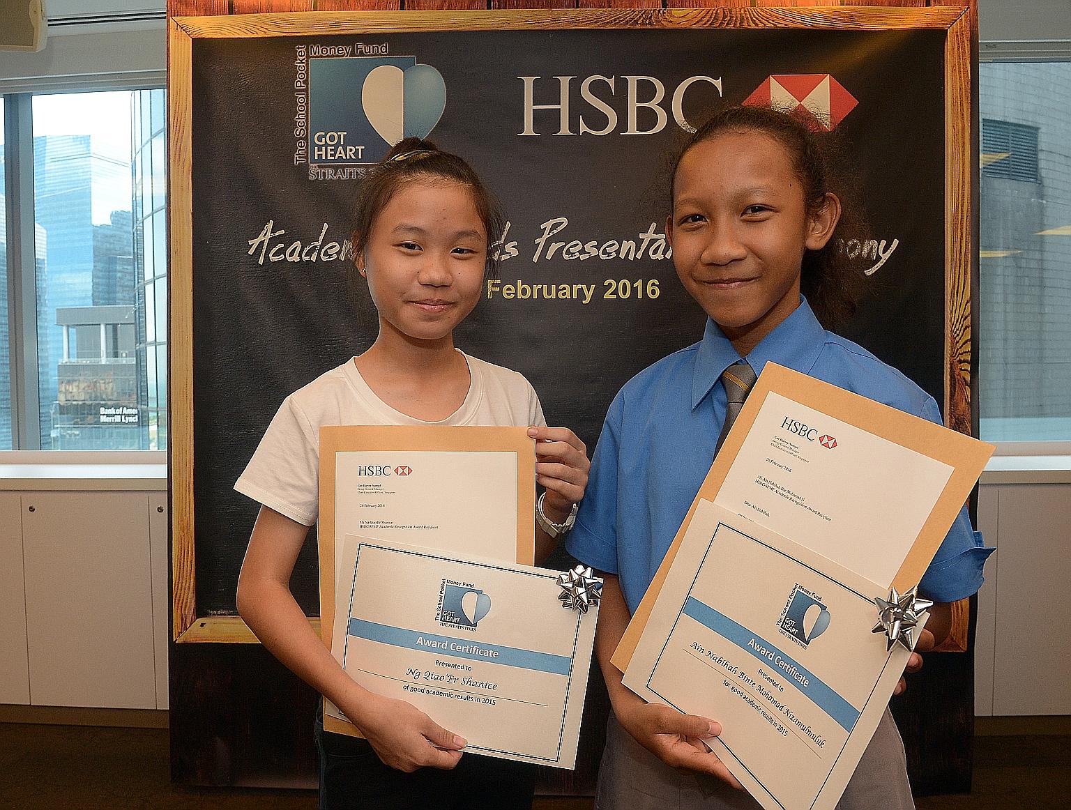 Shanice Ng (far left) and Ain Nabihah, both 13, were among 10 beneficiaries of The Straits Times School Pocket Money Fund who were rewarded for their high PSLE scores with a cash prize from HSBC.