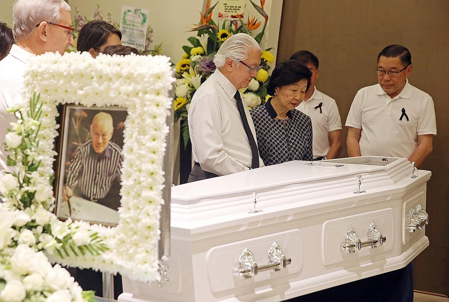 President Tony Tan and Mrs Tan, accompanied by the sons of the late Mr Lee Khoon Choy - Chuen Neng (right) and Chuen Fei (second from right, partially hidden) - at the wake.