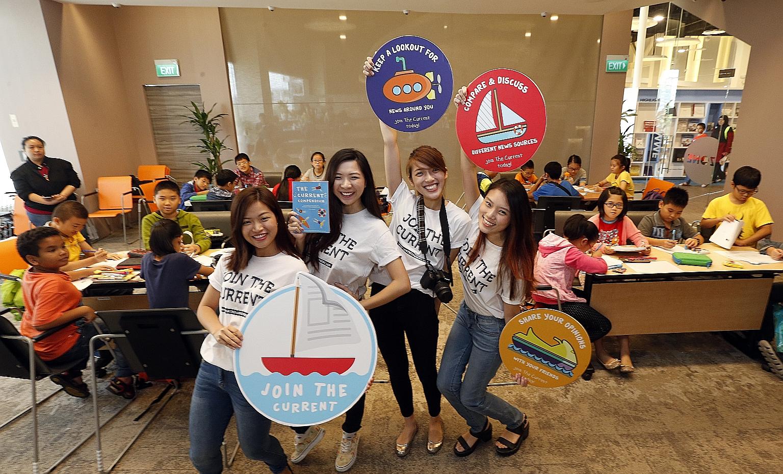 The team of (from left) Ms Natalie Huam, Ms Lynette Teo, Ms Fiona Tan and Ms Miranda Yeo, all aged 22, conducting a workshop at Pasir Ris Public Library. They aim to reach children from lower-income families with their news literacy campaign because 