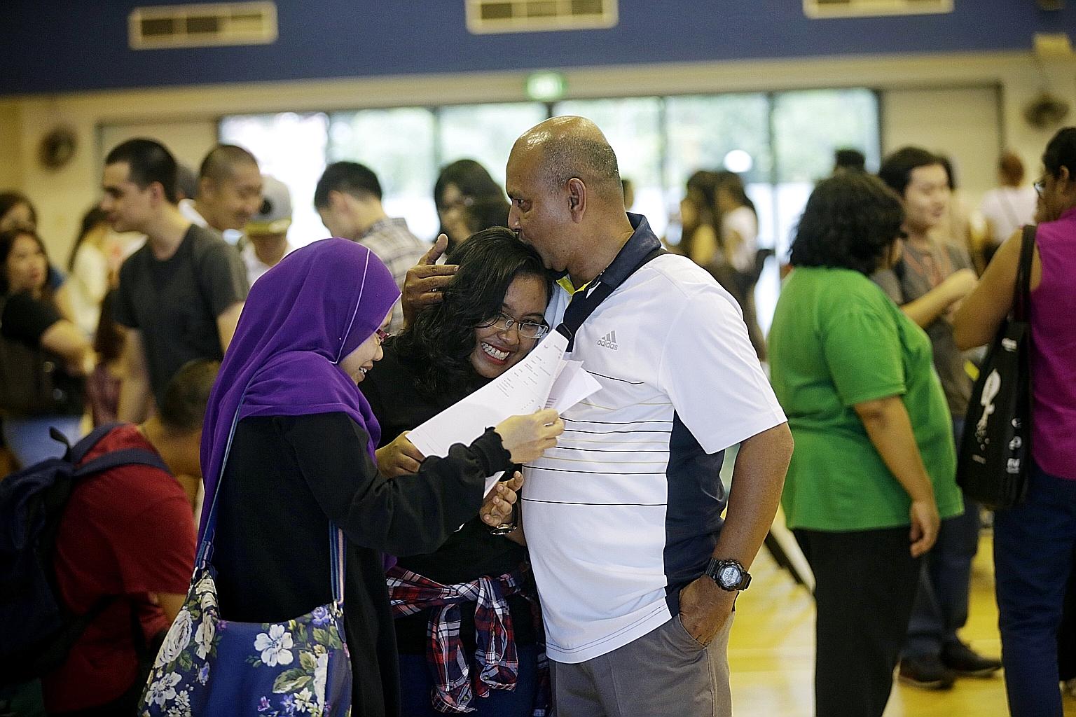 Millennia Institute student Feera Syaqirah Saaduddin, 19, sharing her joy with her father, Mr Saaduddin Abdul Rahim, a 47-year-old Certis Cisco officer, and mother Fauziah Atan, a 45-year-old accounts assistant, after getting her A-level results yest