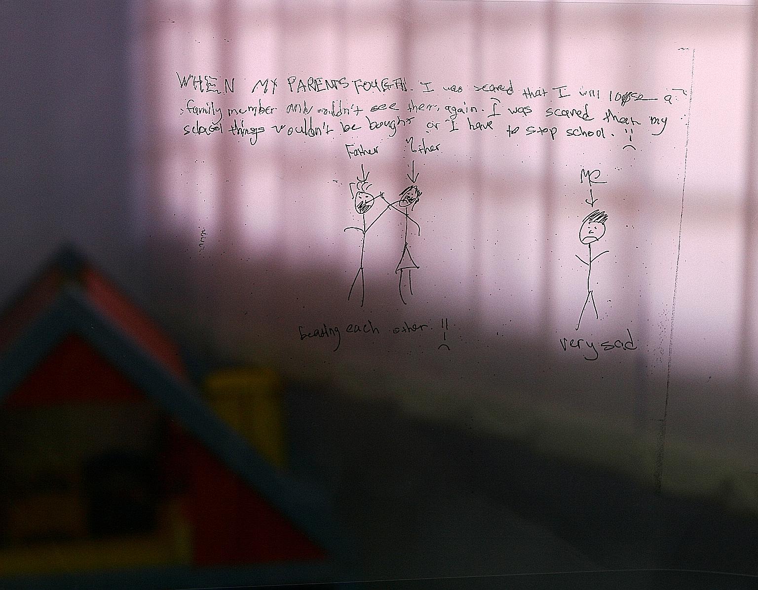 A child pens his thoughts on his parents' impending divorce during a counselling session. Often, children are the ones who suffer the brunt of their parents' disagreements.