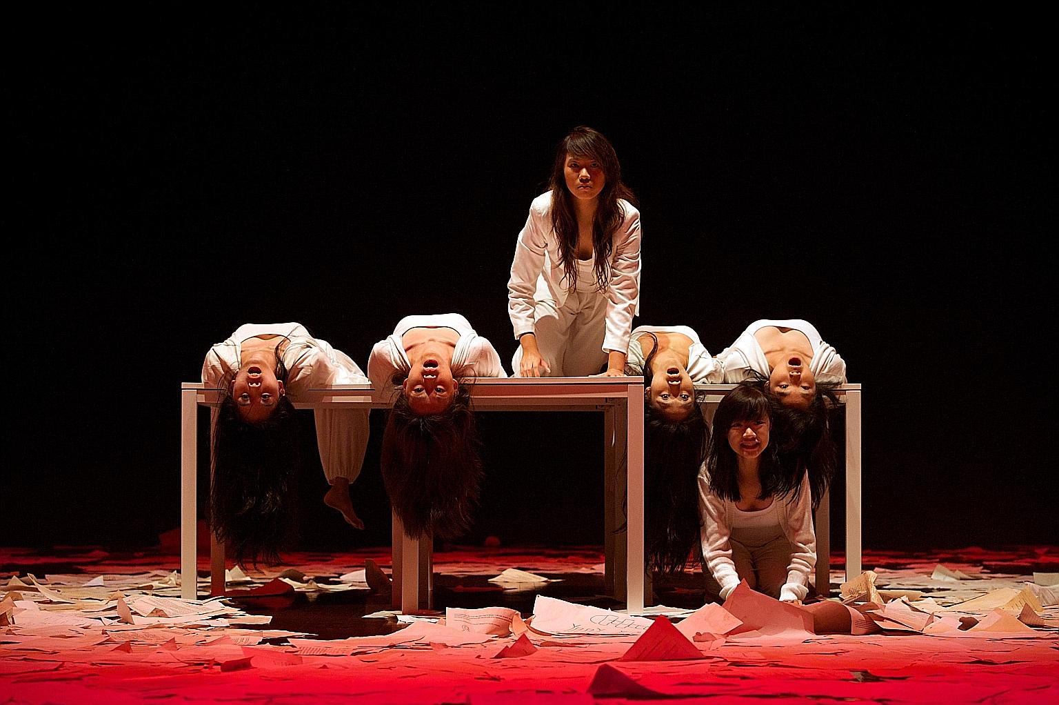 Ms Sim (third from left) performing in a production of Kuo Pao Kun's The Spirits Play. After her A levels in 2013, she shelved her pursuit of a degree to explore her passion in theatre. "I am more focused in university now because I have a clearer s
