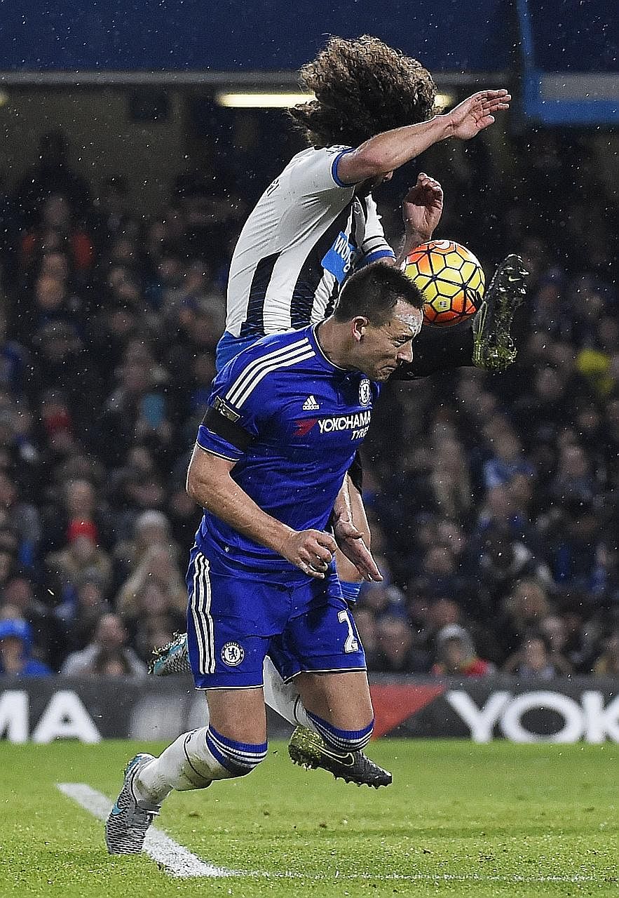 Chelsea skipper John Terry in action against Newcastle United's airborne Fabricio Coloccini in their Premier League encounter on Feb 13. The Blues' skipper is injured but Diego Costa should be fit to play against Paris Saint-Germain in the Champions 