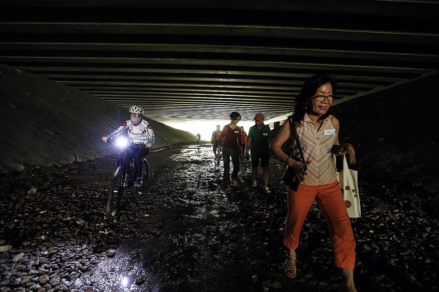 Queenstown and Buona Vista residents exploring the Rail Corridor yesterday. Their ideas for its development include fitness areas under the Queensway viaduct and a grassy trail in place of the muddy tracks.