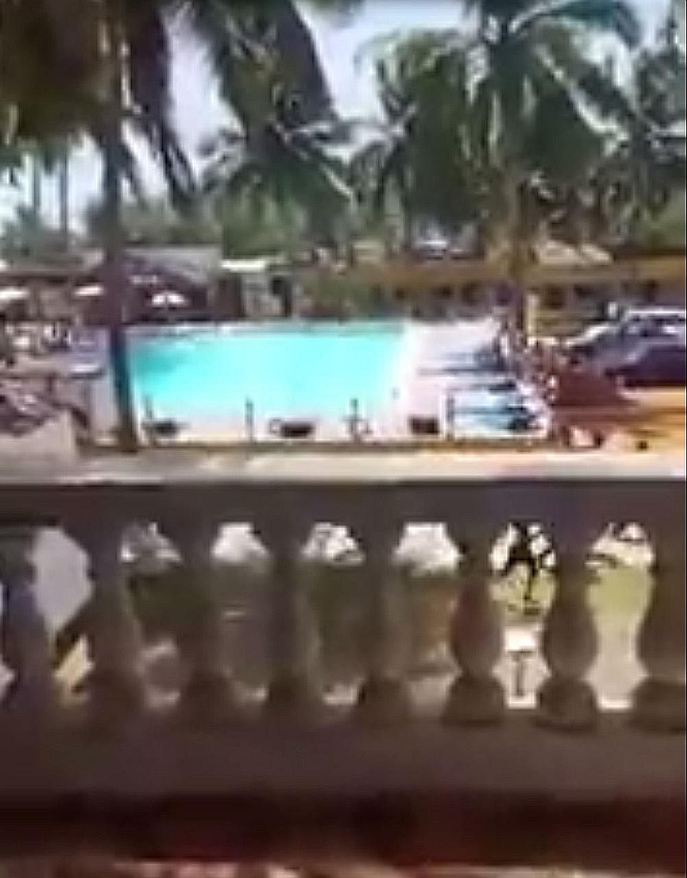 People fleeing (at bottom right) the shooting at the beach resort of Grand-Bassam yesterday. The beach was evacuated by the national police and French armed forces amid the hostage crisis.
