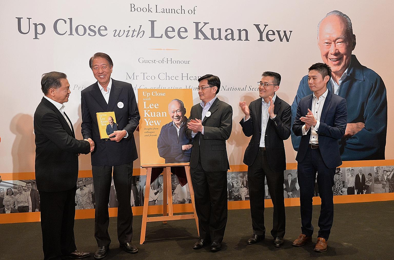 (From far left) Changi Airport Group chairman Liew Mun Leong presenting the book, Up Close With Lee Kuan Yew, to DPM Teo Chee Hean, along with Finance Minister Heng Swee Keat, Maritime and Port Authority chief executive Andrew Tan and Temasek Holding