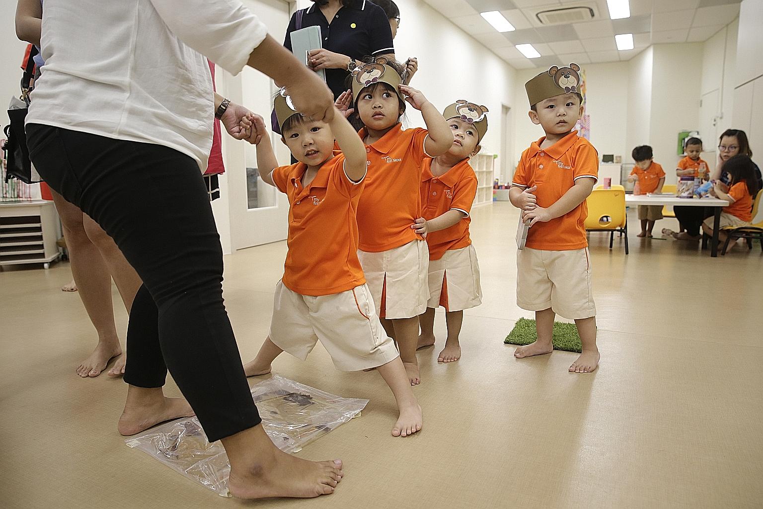 Children at the newly opened My First Skool centre in Waterway Point. The drop in the median monthly fee for full-day childcare comes after 169 centres run by 23 operators made a one-off fee reduction in January, as required under the new partner ope
