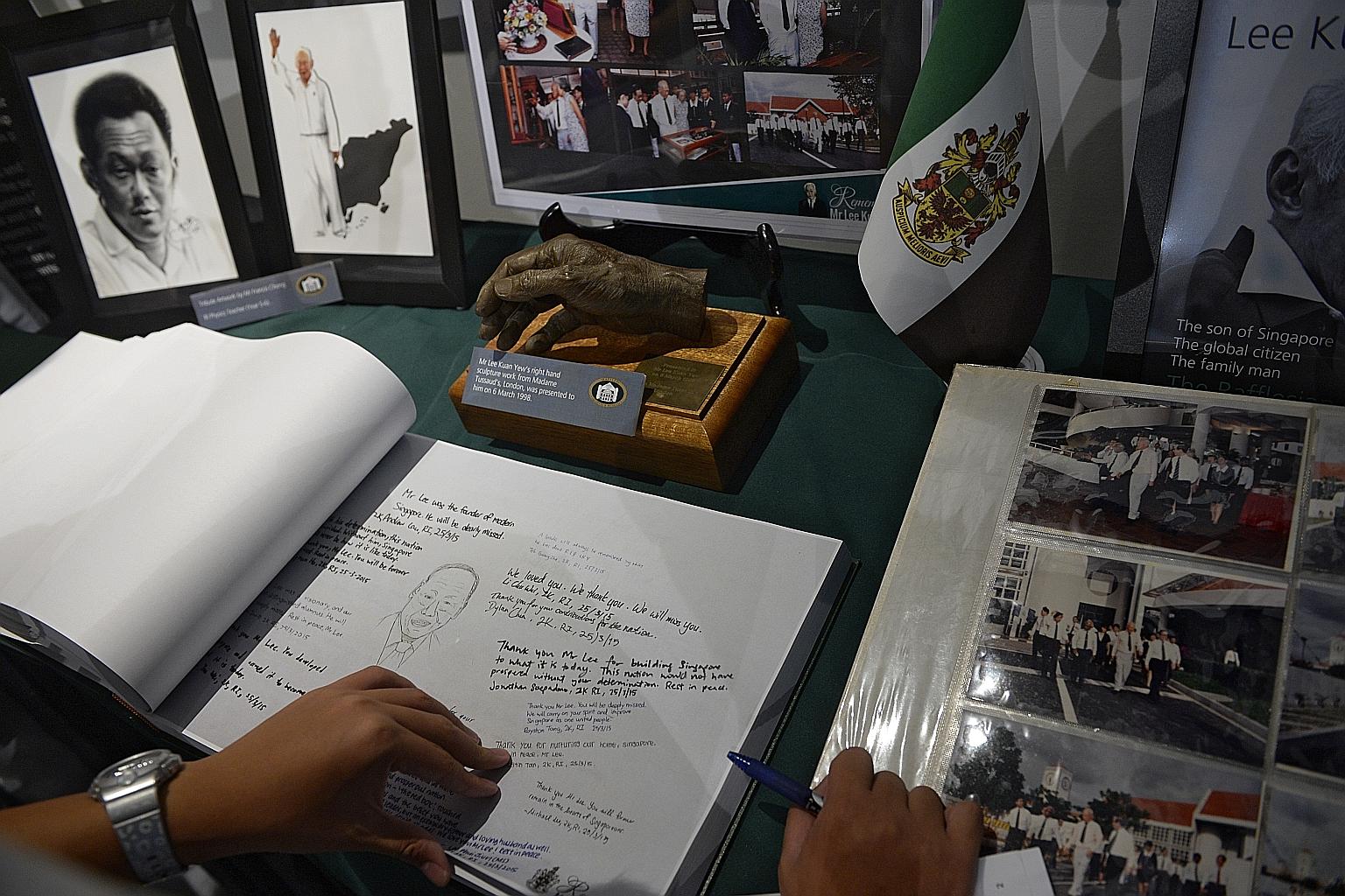 A tribute corner set up at the Raffles Institution Archives and Museum, including a book for students, teachers, staff, parents and alumni to pen their messages. Mr Lee studied at RI from 1936 to 1940. The school held a ceremony yesterday to commemor