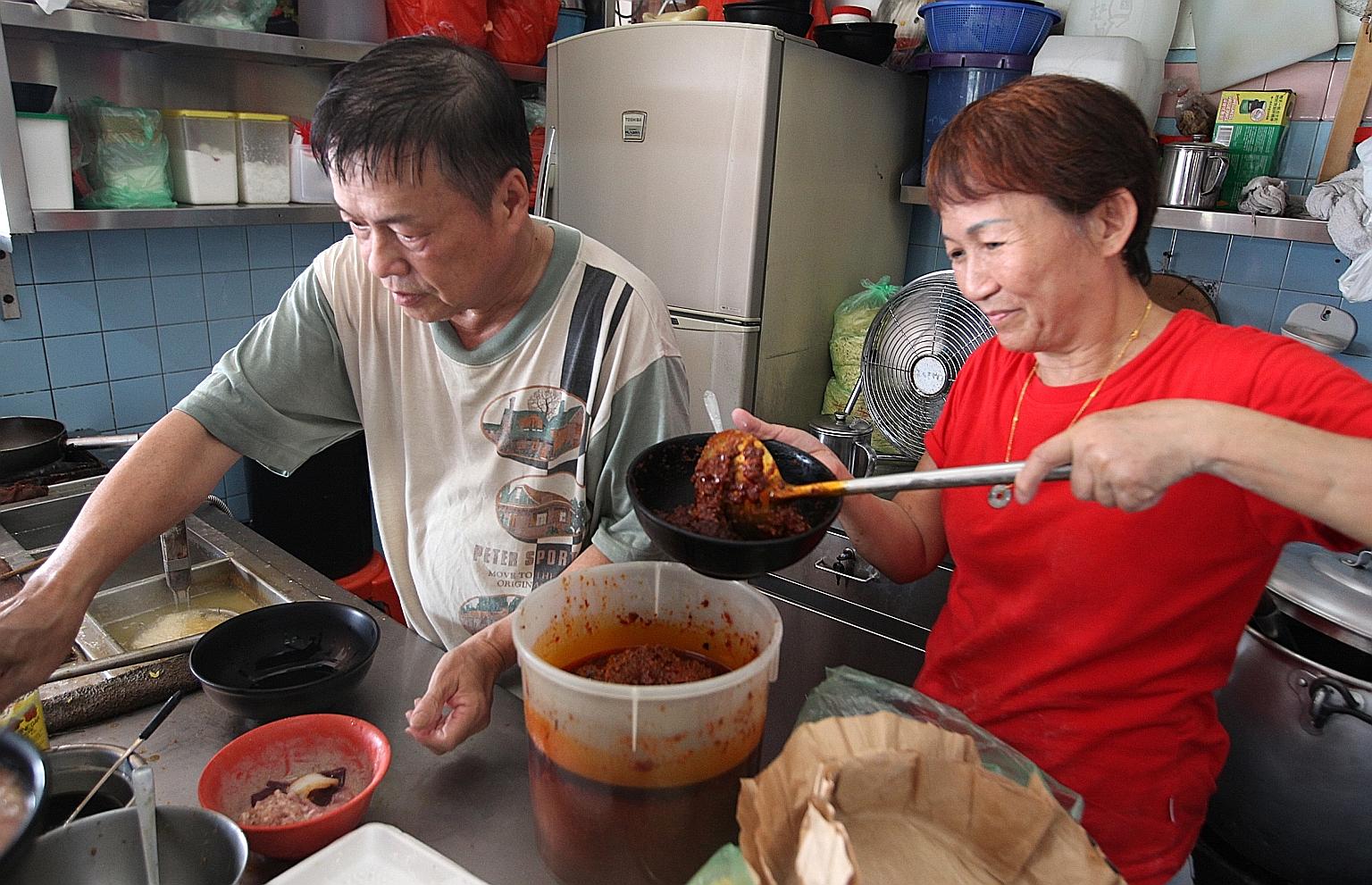 Mr Yap and his assistant, Madam Chong, hard at work at his MacPherson Minced Meat Noodles stall. His trademark bak chor mee dish has been rated by several food websites as among Singapore's best.