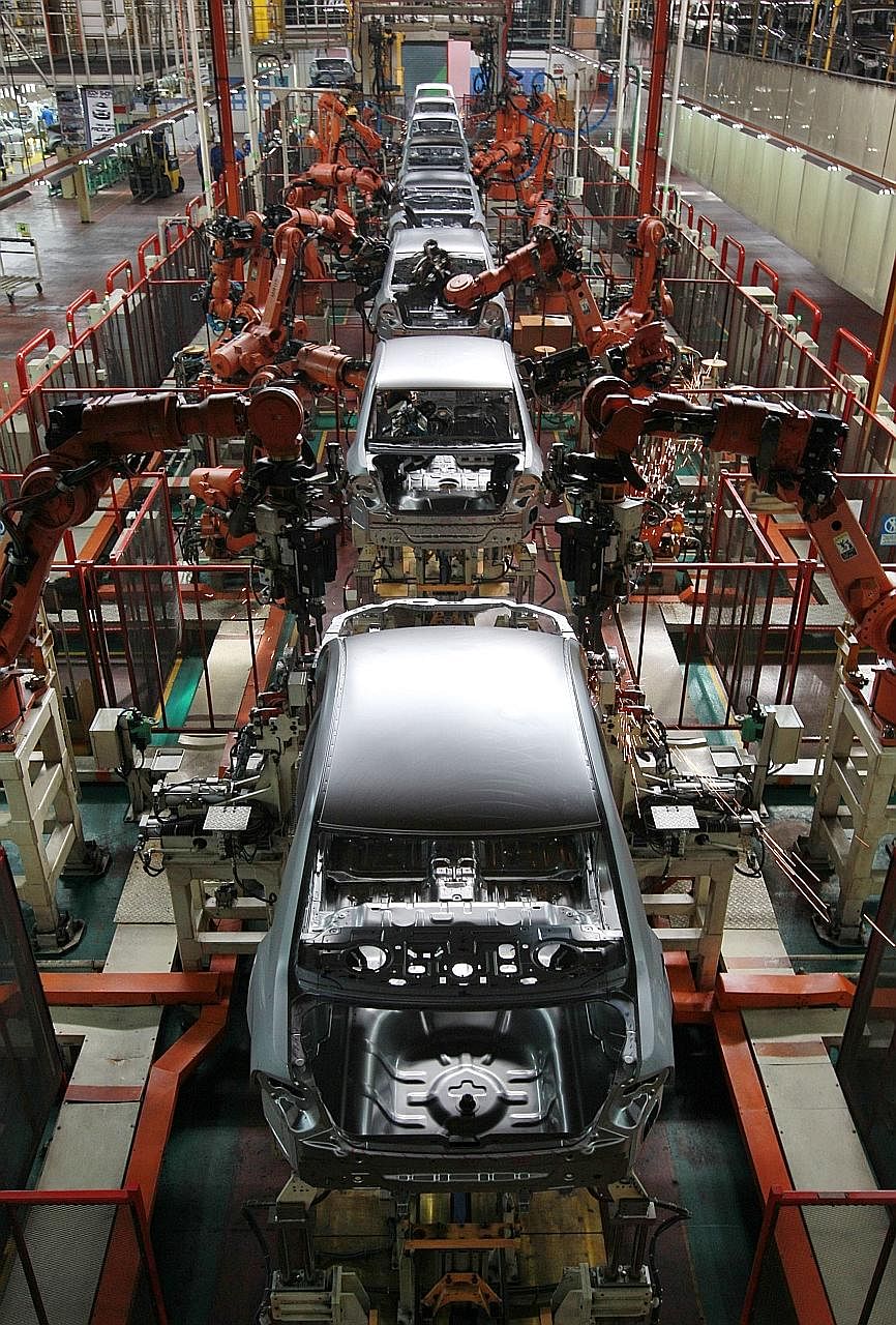 The assembly line at Proton's factory in Shah Alam, Selangor. The gradual liberalisation of the domestic auto market has resulted in Proton's market share plunging from a high of more than 60 per cent in the 1990s.