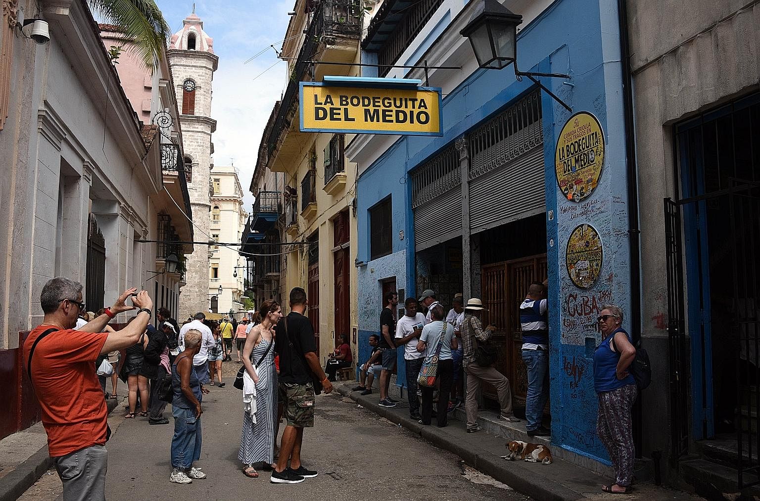 Crowds outside one of Havana's most emblematic bars, the La Bodeguita del Medio. Cuba is the newest aspirant at the door of globalisation.