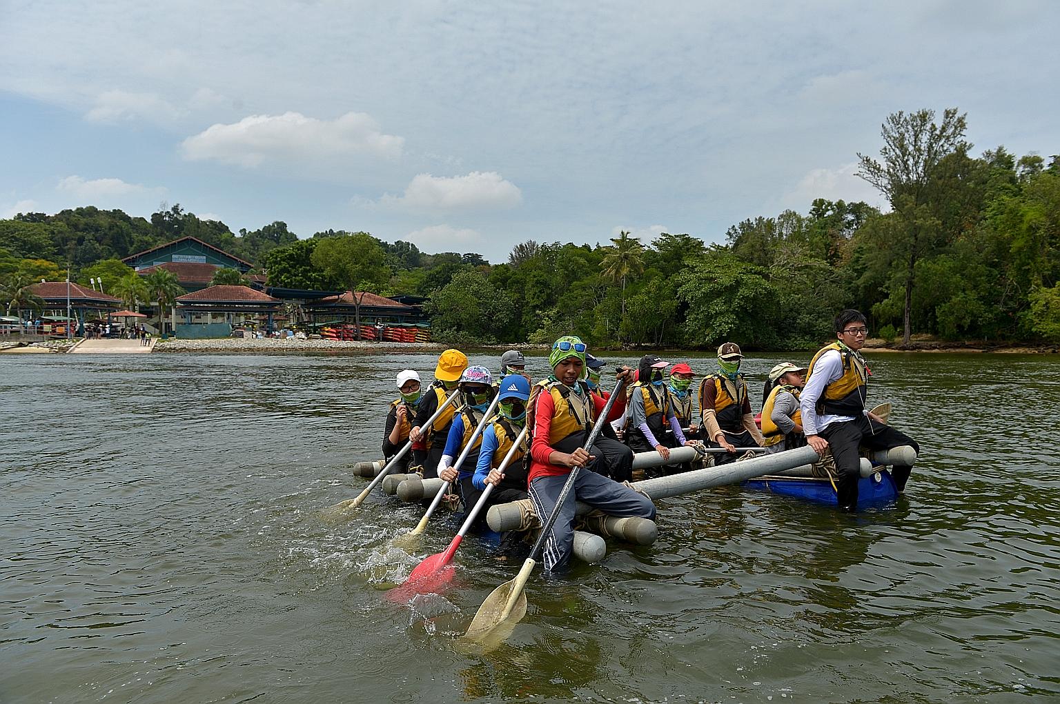 Participants on a water raft they constructed at OBS' Pulau Ubin campus. OBS is looking into different ideas to fully utilise the potential of its campus on Coney Island and its location.