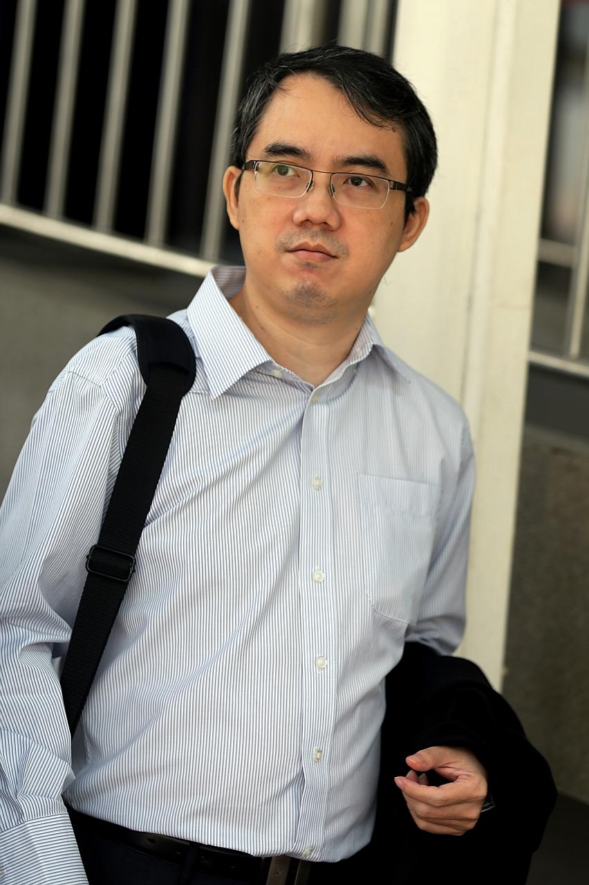 Lee (right) was convicted of four charges of causing hurt to his intern, Mr Chan, at his Jurong Town Hall Road office between January and May 2013. Another intern had taken a 17-second video (above) of Lee hitting Mr Chan and posted it online, where 