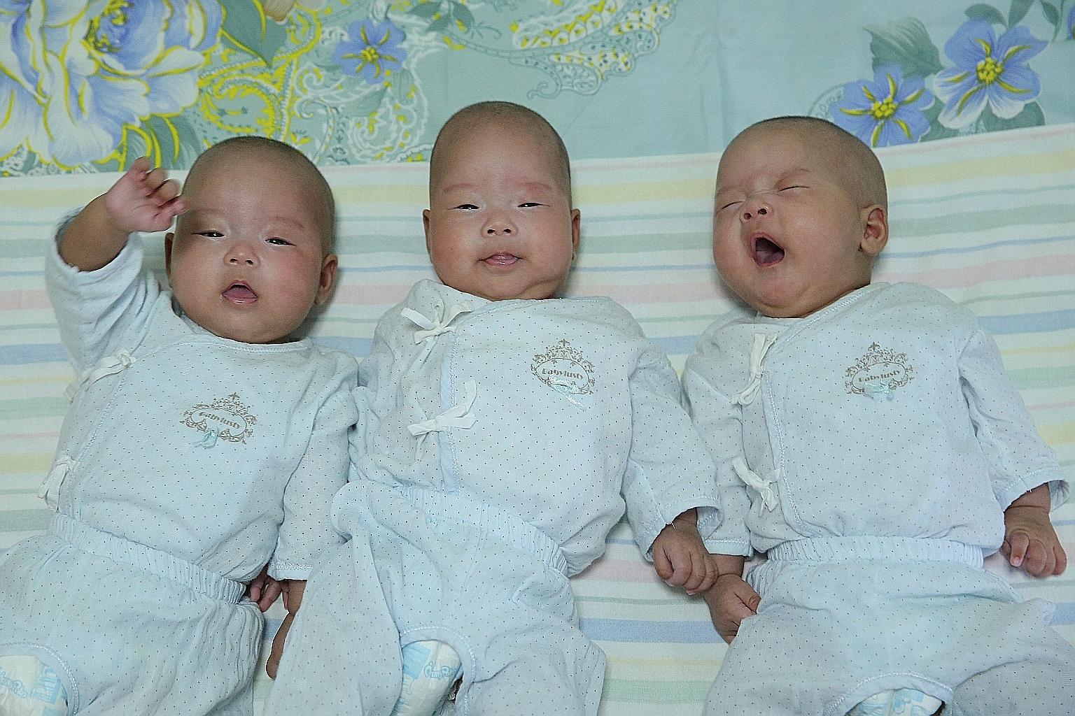 The triplets were granted citizenship by the Immigration and Checkpoints Authority last month. Their mother, Madam Ning, says the last time she was in touch with her Singaporean husband was on Chinese New Year's Eve, when he transferred some money to
