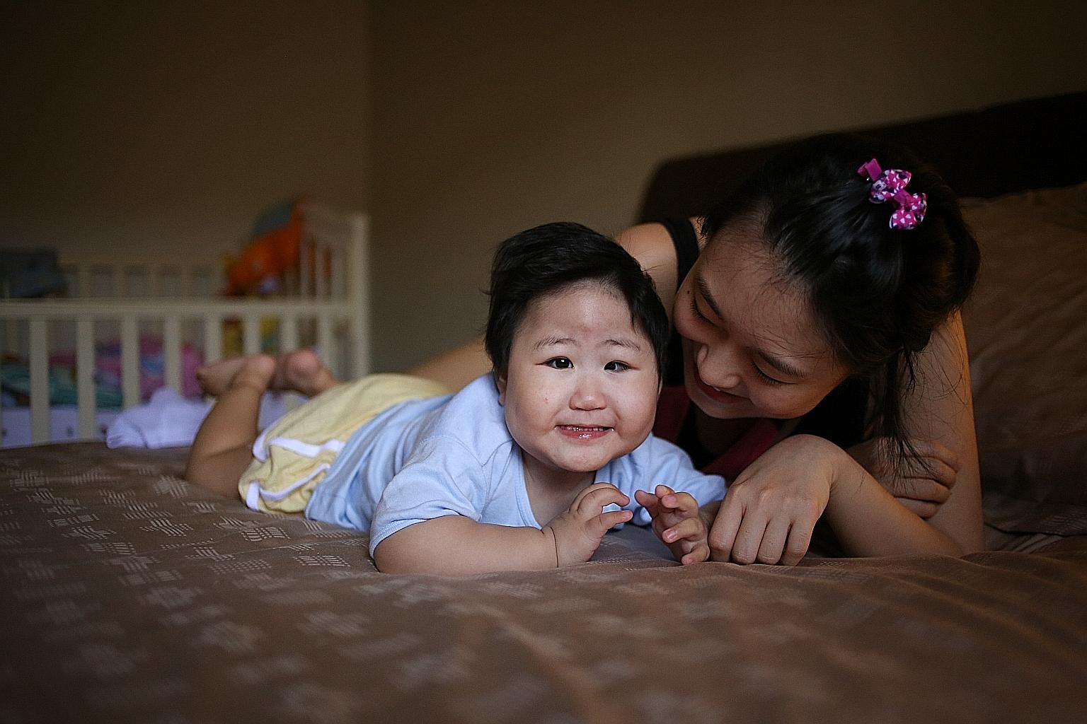 Two-year-old Yujia, seen here with her mother, Madam Chua, was born with oesophageal atresia and has to be fed through a tube. Her parents hope to raise enough money for her to have surgery in the US.