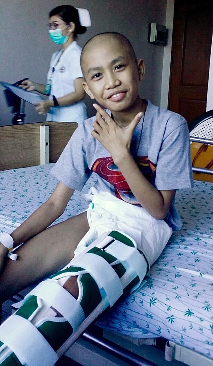 Filipino maid Ms Canete said her son, Dave (above), who had a tumour, is more cheerful after surgery.