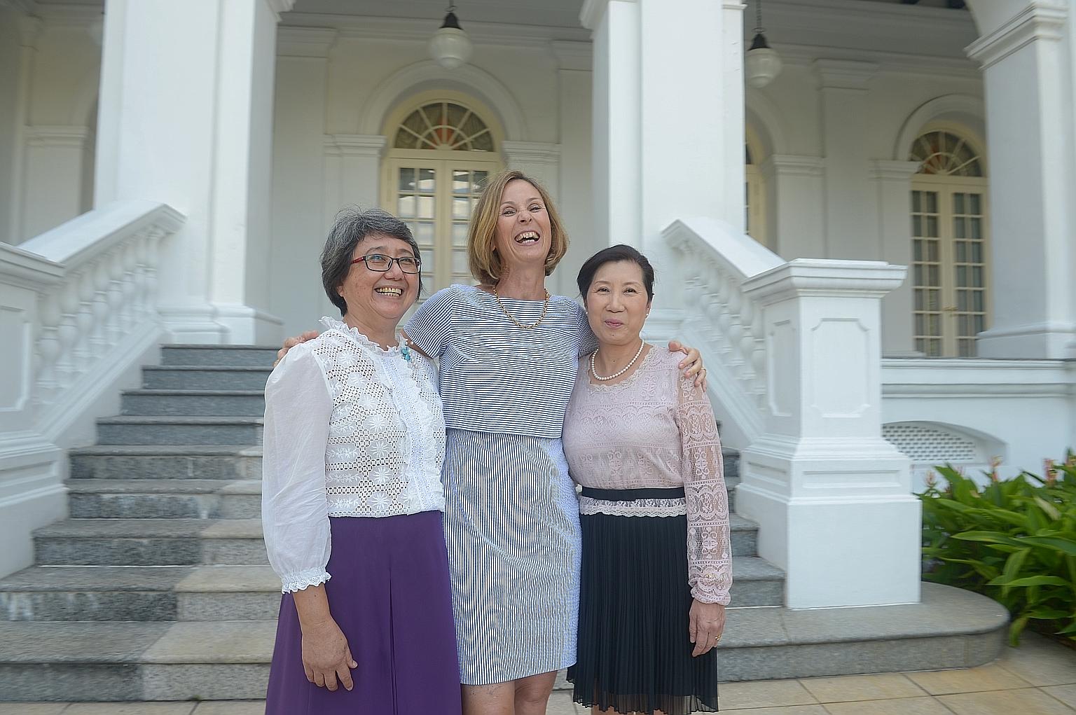 (From far left) Madam Chia Bee Lian and Madam Karine Hoffer are volunteer guides at the Istana on its open house days, while Madam Leong Yoke Lim, training director at make-up school Cosmoprof Academy, sends her students to do face painting for child