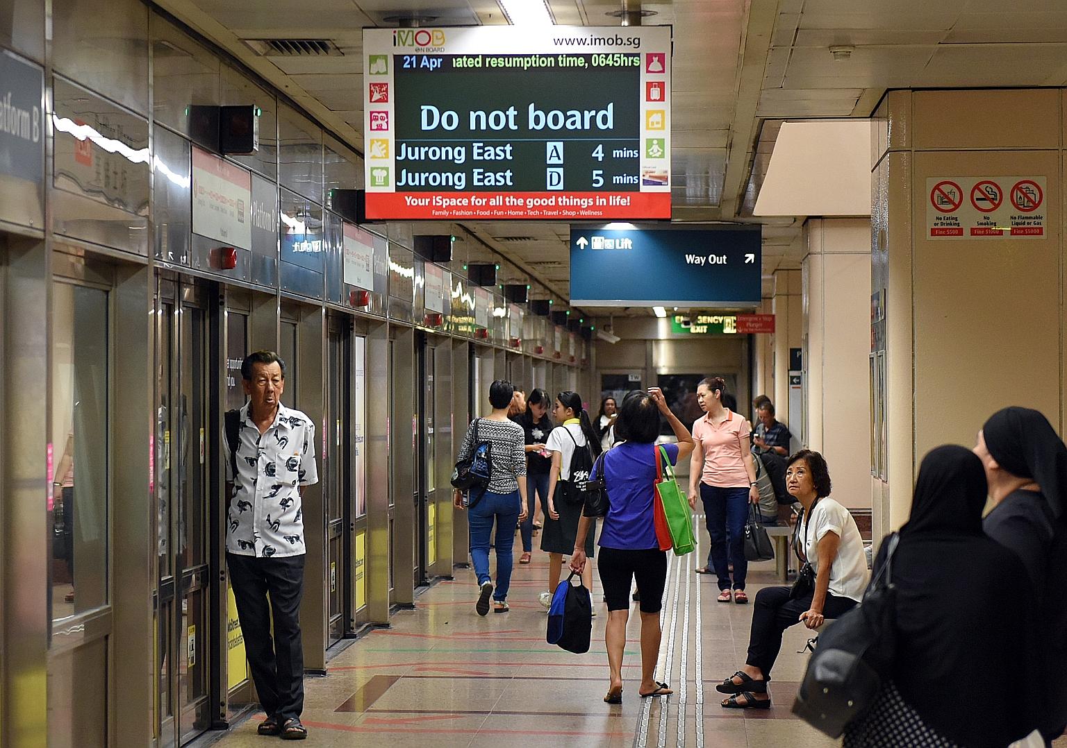 Passengers waiting for train services along the North-South Line to resume at Raffles Place station yesterday at 6.30am. Service was restored at around 6.50am. On the North East Line, service on part of the line was affected just after 11am, for abou