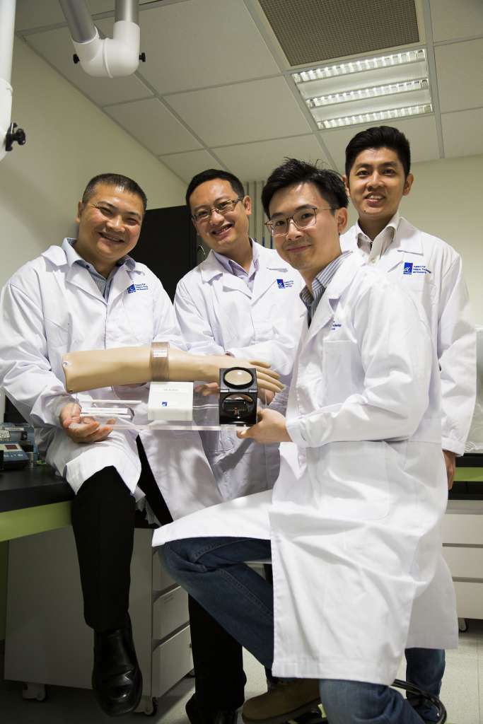 Members of the A*Star team (from left) Dr Alex Gu Yuandong, Dr Michael Ho Chee Keong, Dr Tan Ee Lim and Dr Cheong Jia Hao with the device they came up with in collaboration with vascular surgeon Benjamin Chua. 