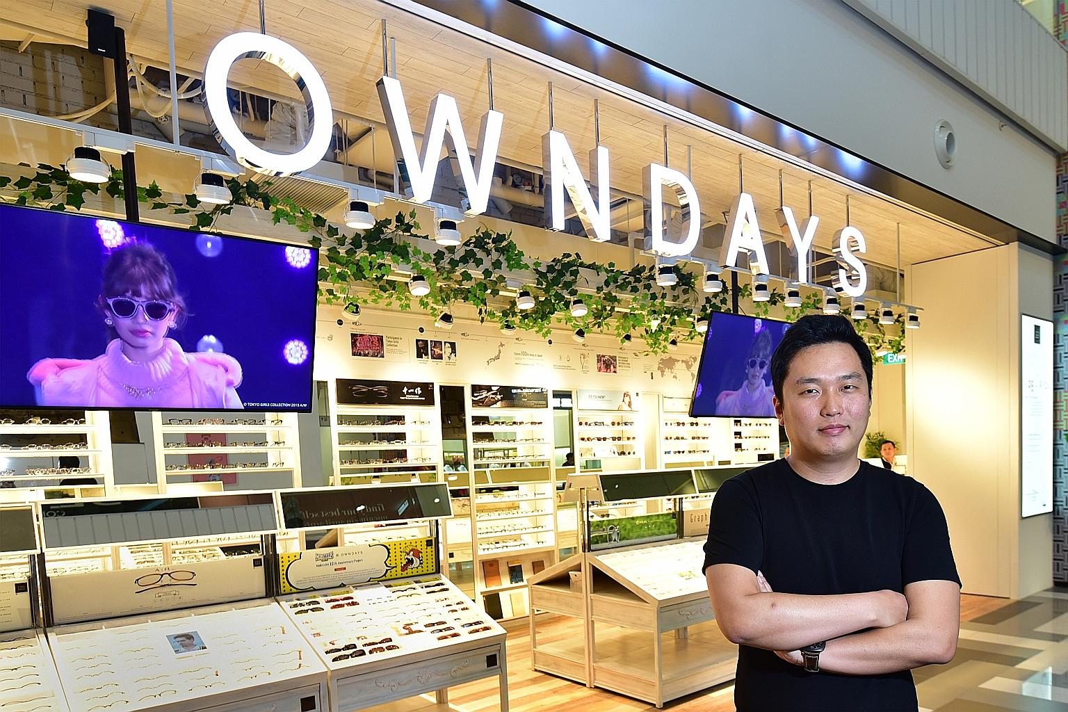Mr Umiyama, managing director of Owndays Singapore, outside the chain's new store in Tiong Bahru Plaza. He attributes its success here to a simple price structure and quick service as compared to local shops. Many Owndays customers can collect their