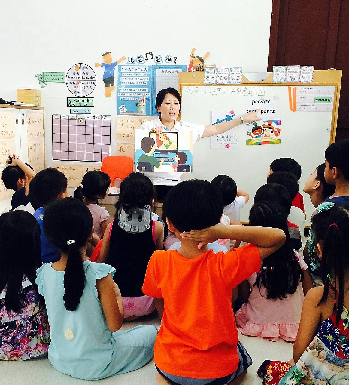 A staff member of Singapore Children's Society conducting a KidzLive session. The society runs such sessions at pre-schools for free to teach five- and six-year-olds "body safety skills".