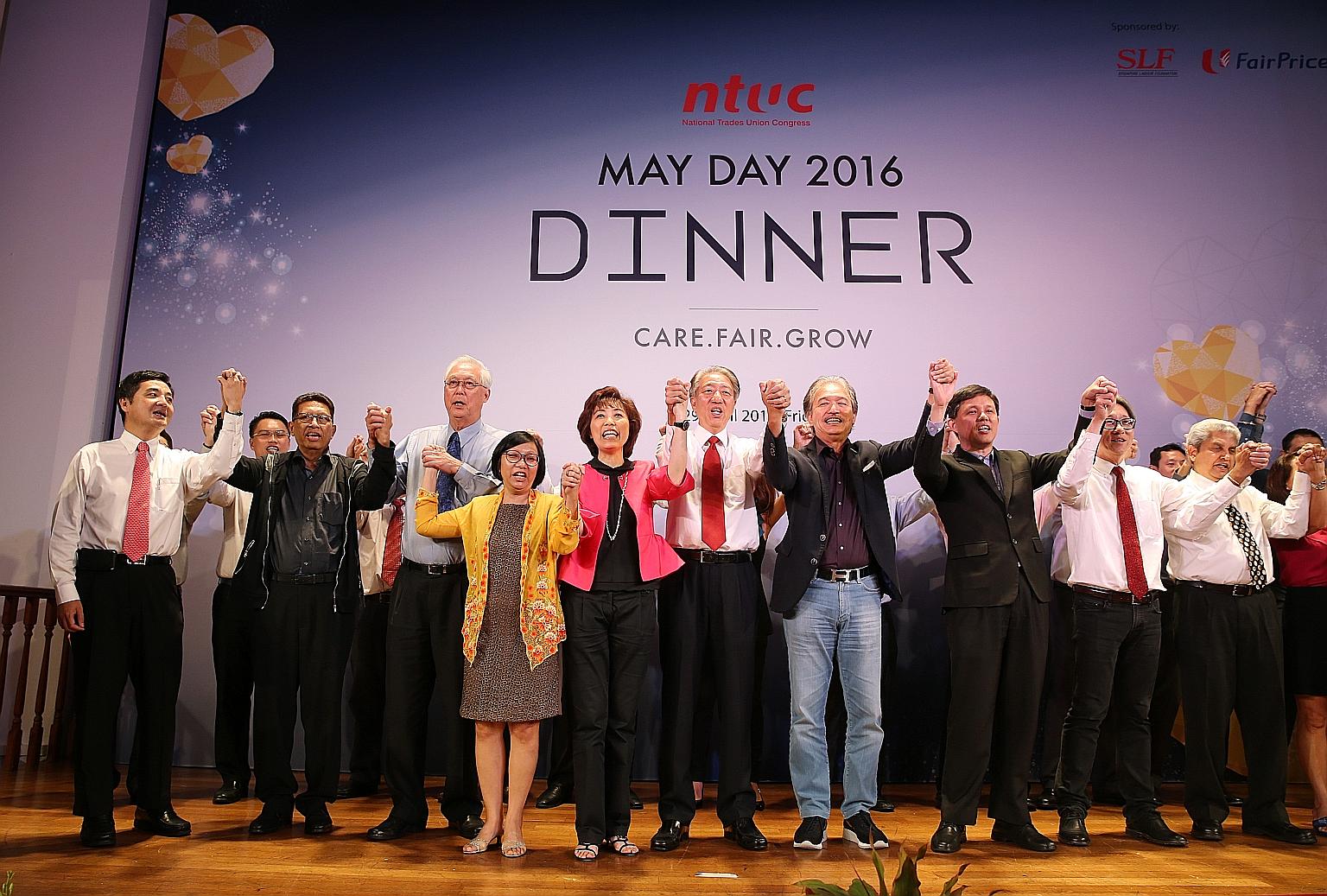 NTUC central committee members singing with (front row, from left) NTUC deputy secretary-general Heng Chee How, NTUC president emeritus John De Payva, Emeritus Senior Minister Goh Chok Tong, NTUC's first woman president Diana Chia, NTUC president Mar