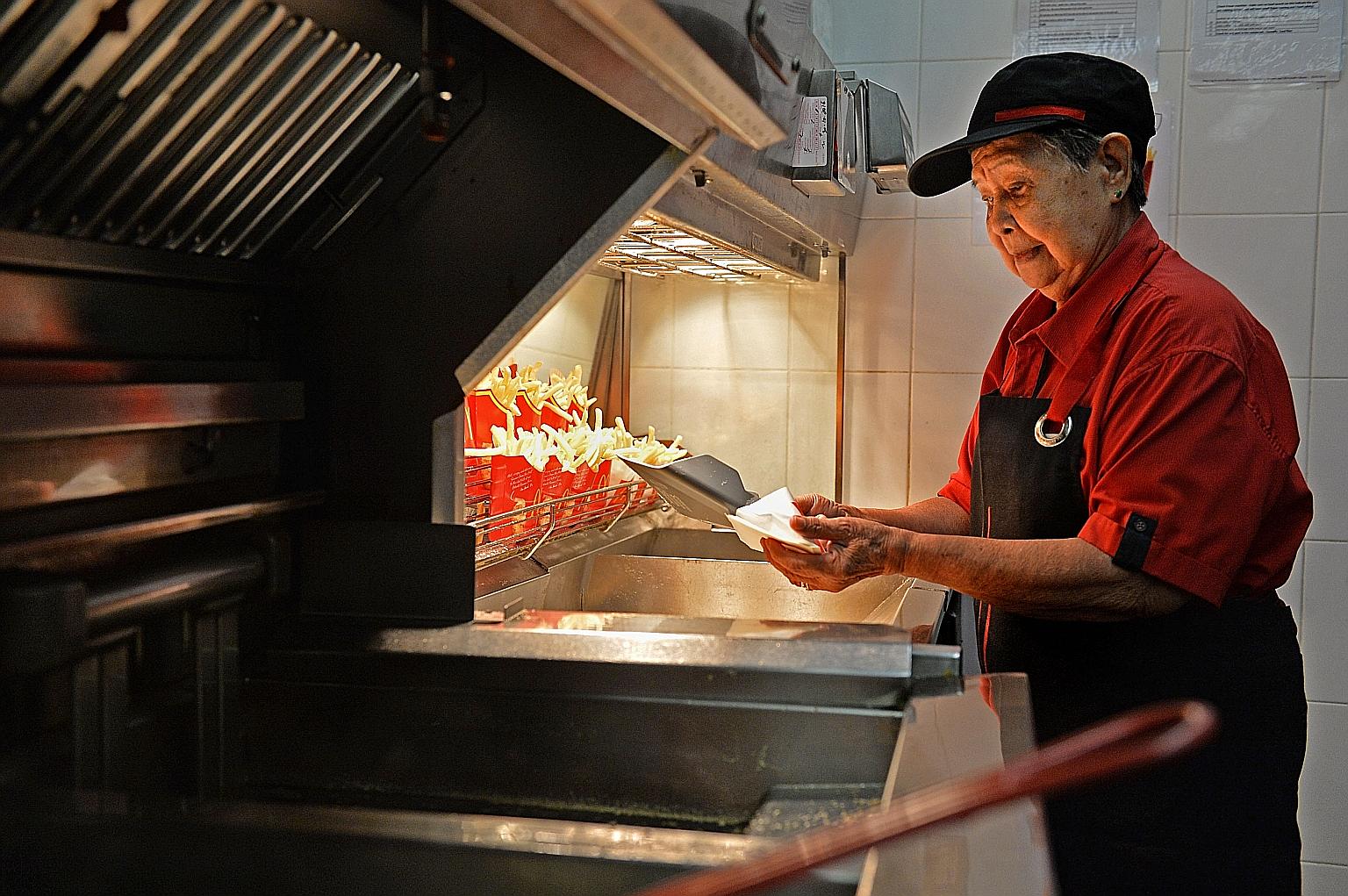 Madam Goh Gwek Eng finds cooking french fries the most challenging as it can get very hot near the fryer.