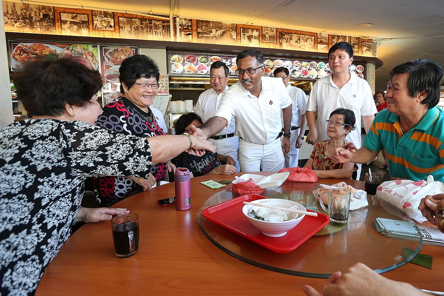 Mr Murali greeting residents while on a walkabout in Bukit Batok yesterday. The PAP candidate for the by-election says he will work with non-profit organisation, The Good Life Cooperative, to provide regular health screenings and check-ups for elderl
