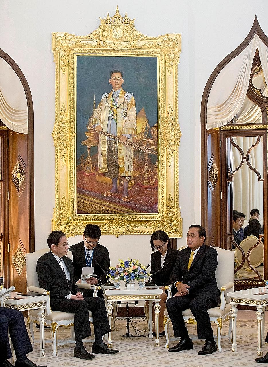 Japan's Foreign Minister Fumio Kishida (left) meeting Thai Prime Minister Prayut Chan-o-cha at Government House in Bangkok. Mr Kishida urged Asean countries to adhere to three principles of the rule of law at sea in order to maintain peace and stabil