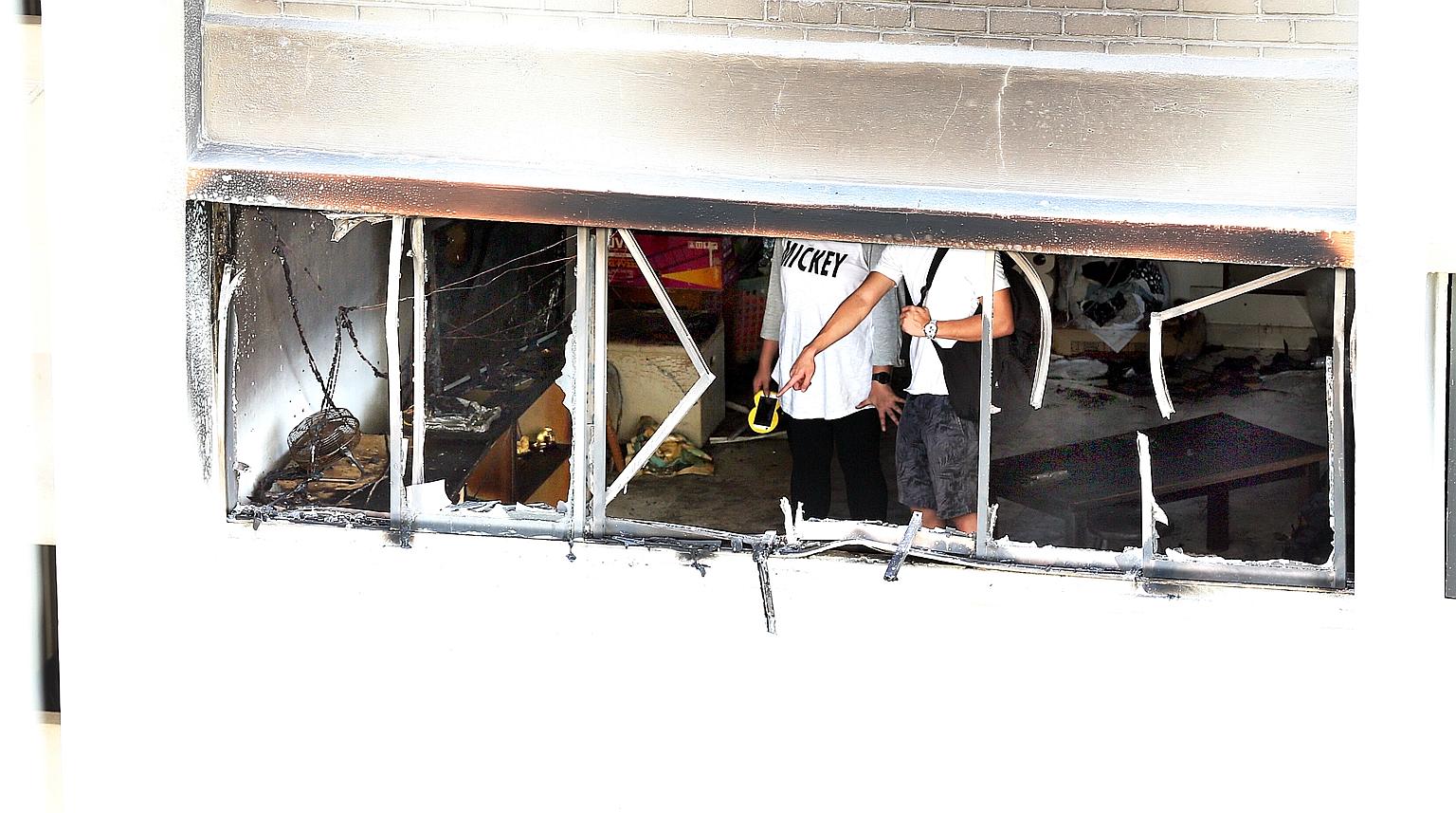 The fire yesterday morning occurred in the living room of an 11th-floor HDB flat in Marsiling Lane 3. SCDF personnel had to force their way into the flat through the front door to put out the blaze with a water jet.