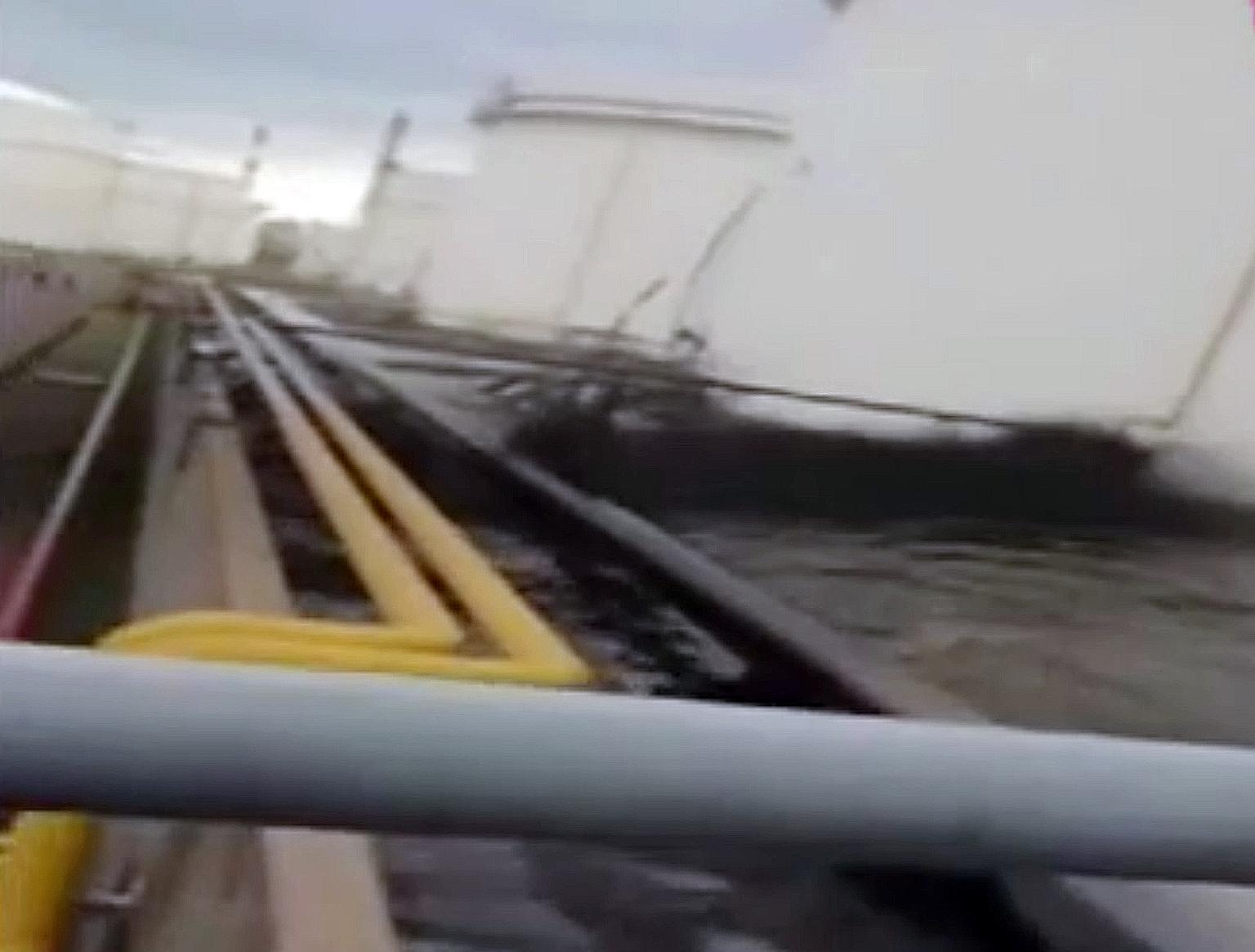 A screen grab from a video sent to Stomp on April 30 shows the oil leaking from a storage tank.