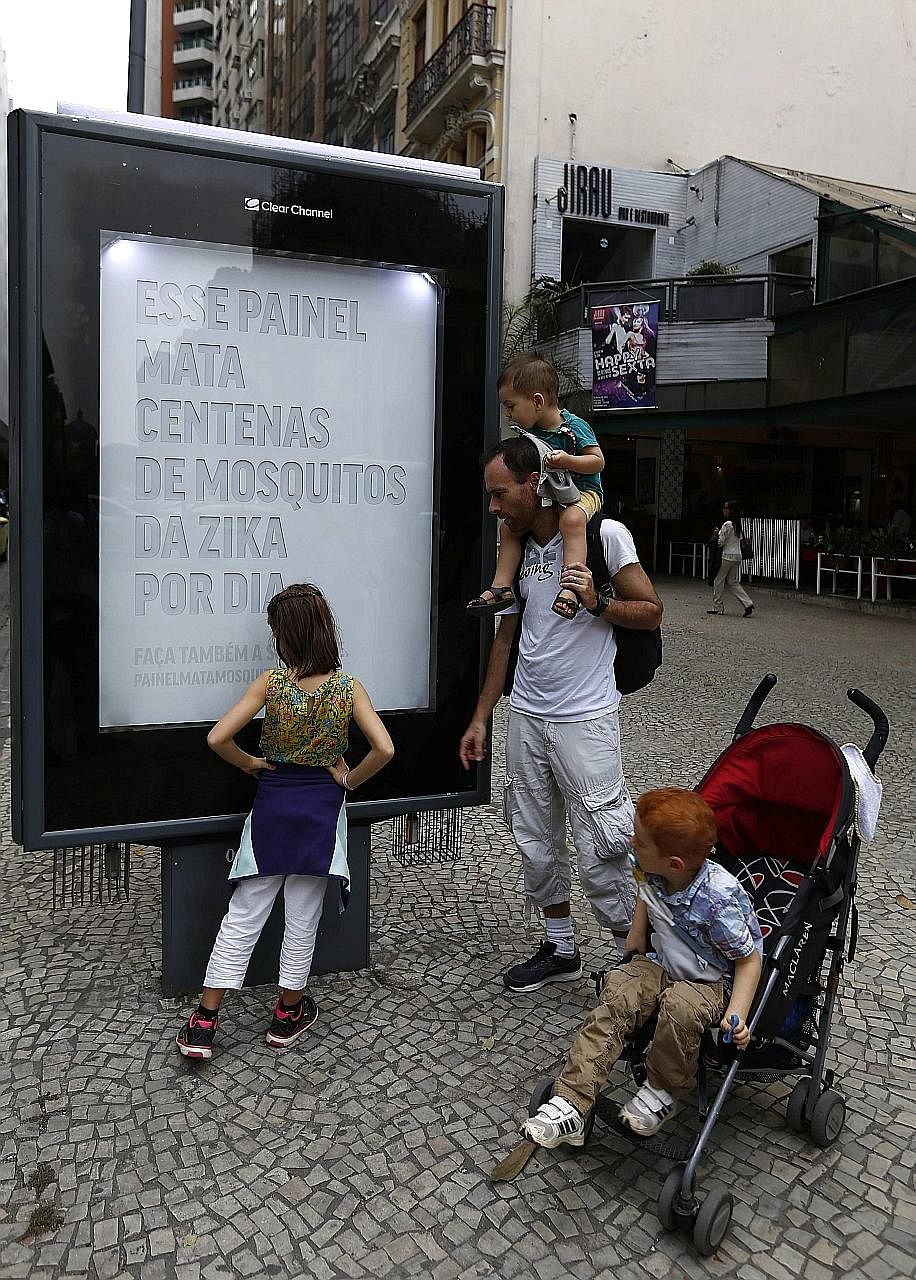 A billboard set up to attract and kill the Aedes aegypti mosquito, responsible for spreading the Zika virus and dengue, in Rio de Janeiro, Brazil. It reads: "This billboard kills hundreds of Zika mosquitoes every day." It replicates the smell of huma