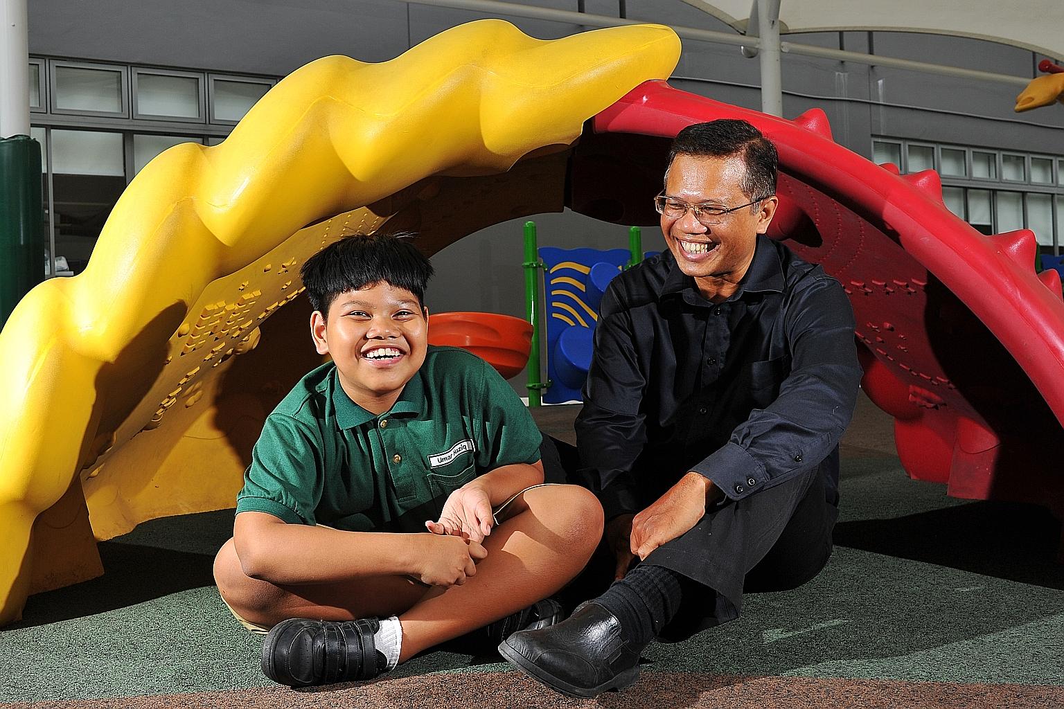 Umar with his father at Fun Square, Sensory Park, in Eden School. Because of autism, Umar's learning development is slower and he has difficulty interacting with other people.