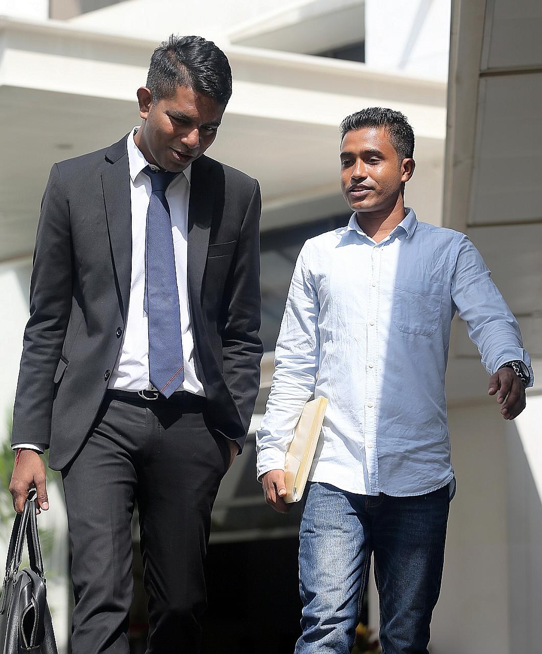 Bangladeshi safety supervisor Shahidulla Md Anser Ali (right) and lawyer Kalidass Murugaiyan, who took on the case pro bono, leaving the court last Friday.